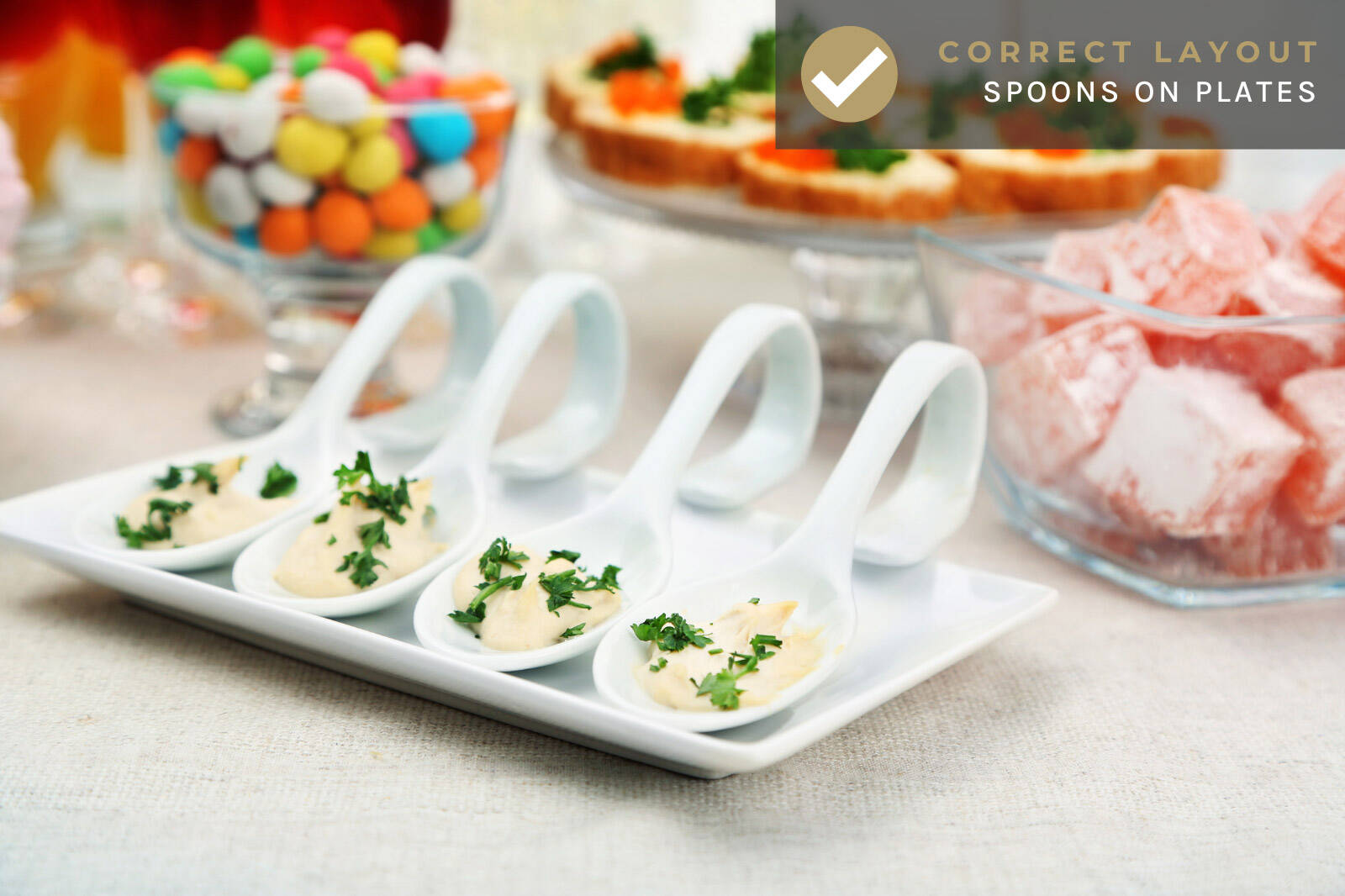 example of a correct dessert table layout with tasting spoons arranged on serving trays / plates