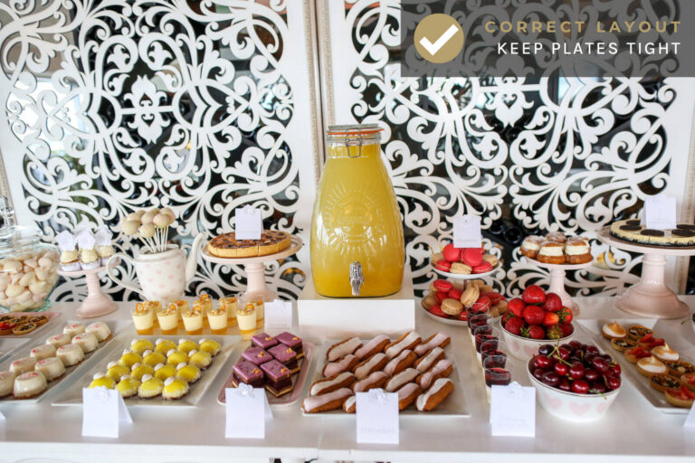 a correct dessert table layout with tightly arranged plates and serving trays