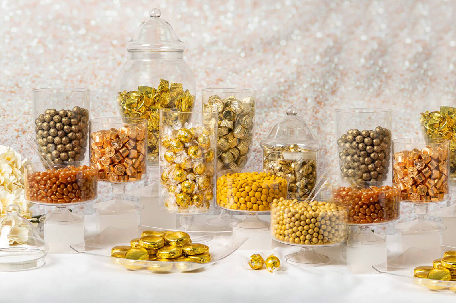 candy in apothecary jars to add height to your dessert table layout