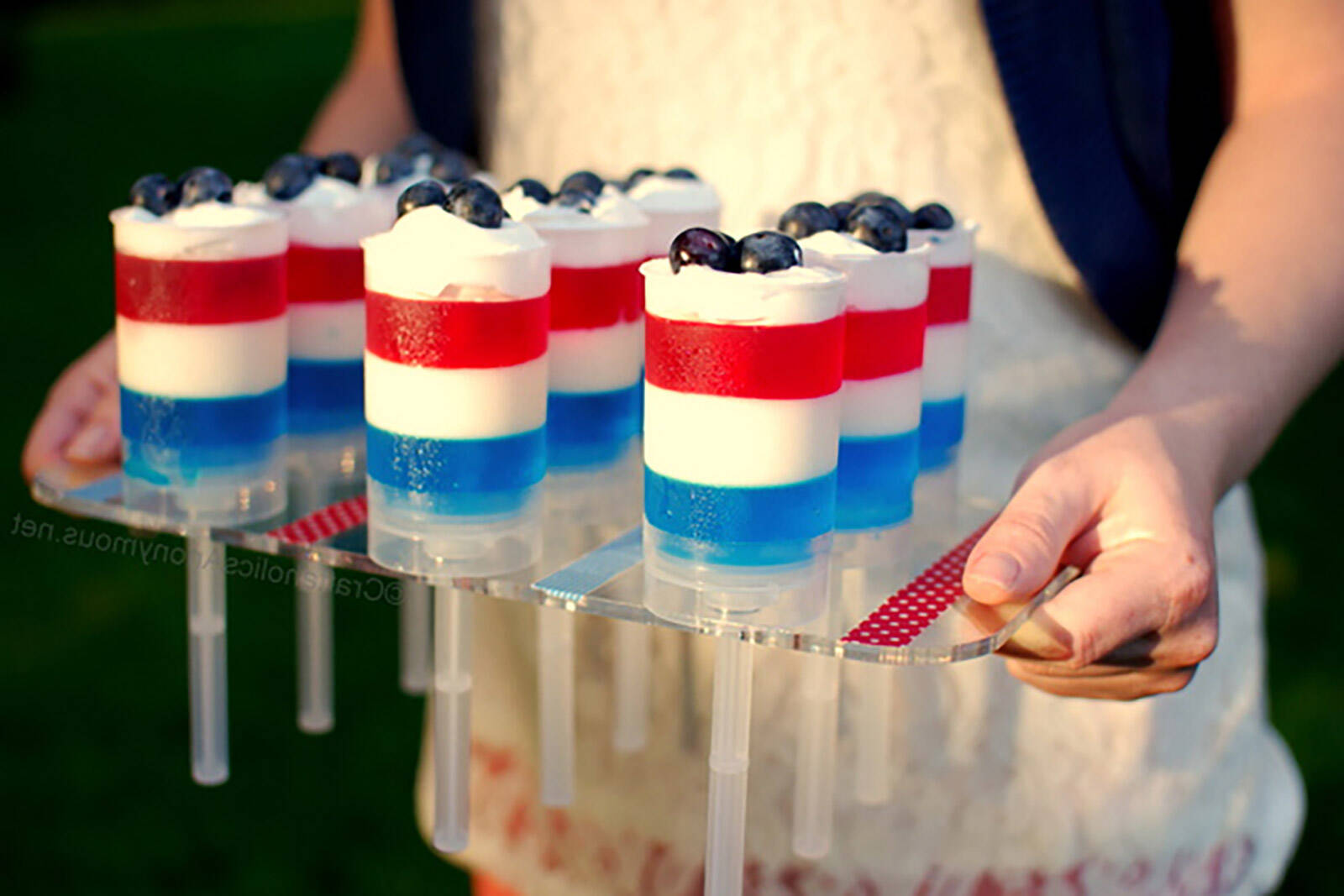push-up pop containers to serve desserts in on a dessert table
