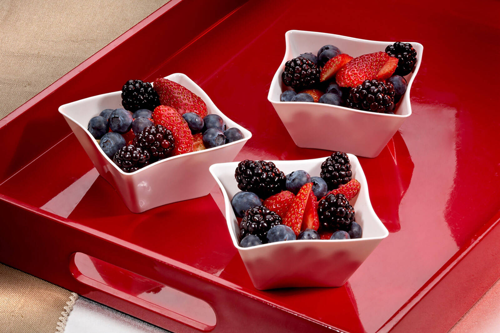 mini disposable treat bowls filled with fruit