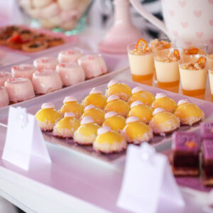 desserts laid out in rows on square serving plates