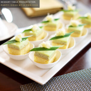 desserts served in mini dessert cups laid out in rows on a party dessert table