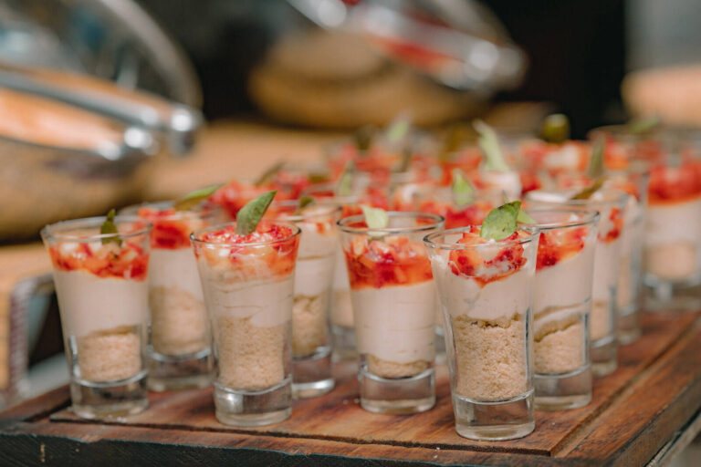 mini desserts served in shooter glasses