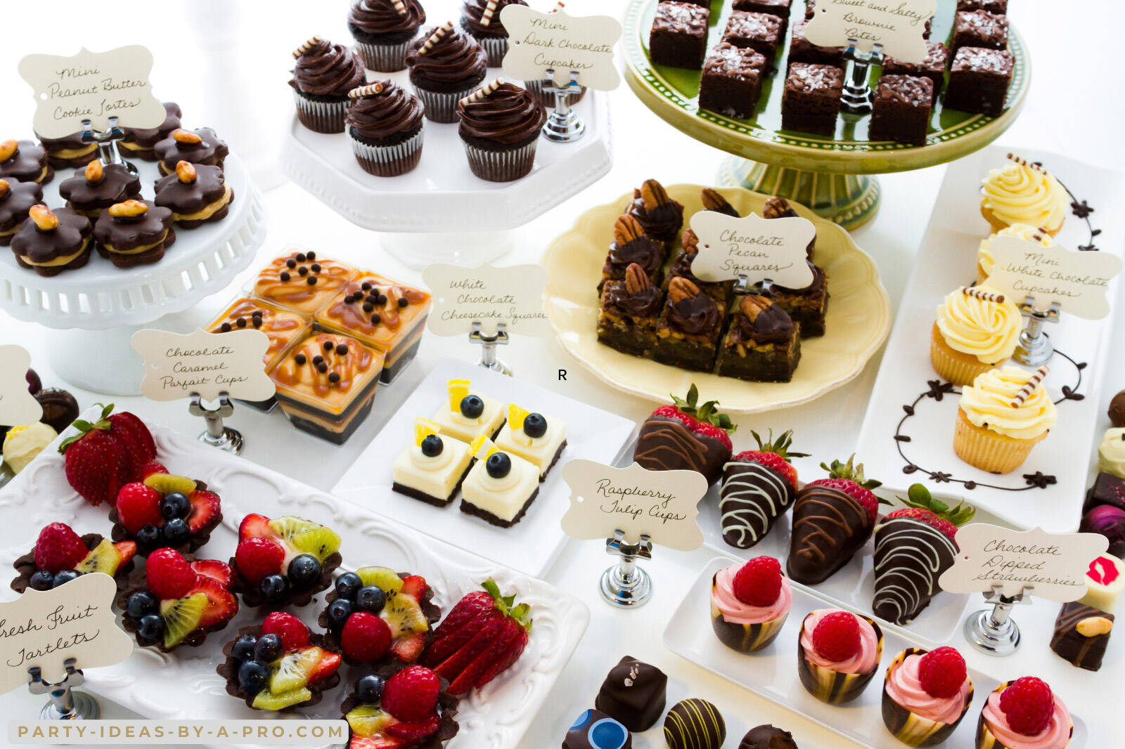 a selection of desserts on a party dessert table