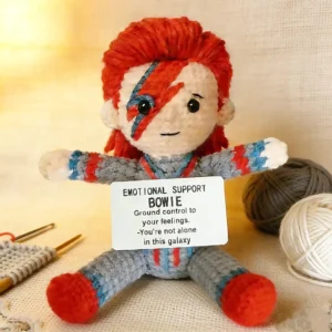 Crocheted David Bowie doll labeled Emotional Support Bowie with a lightning bolt face design