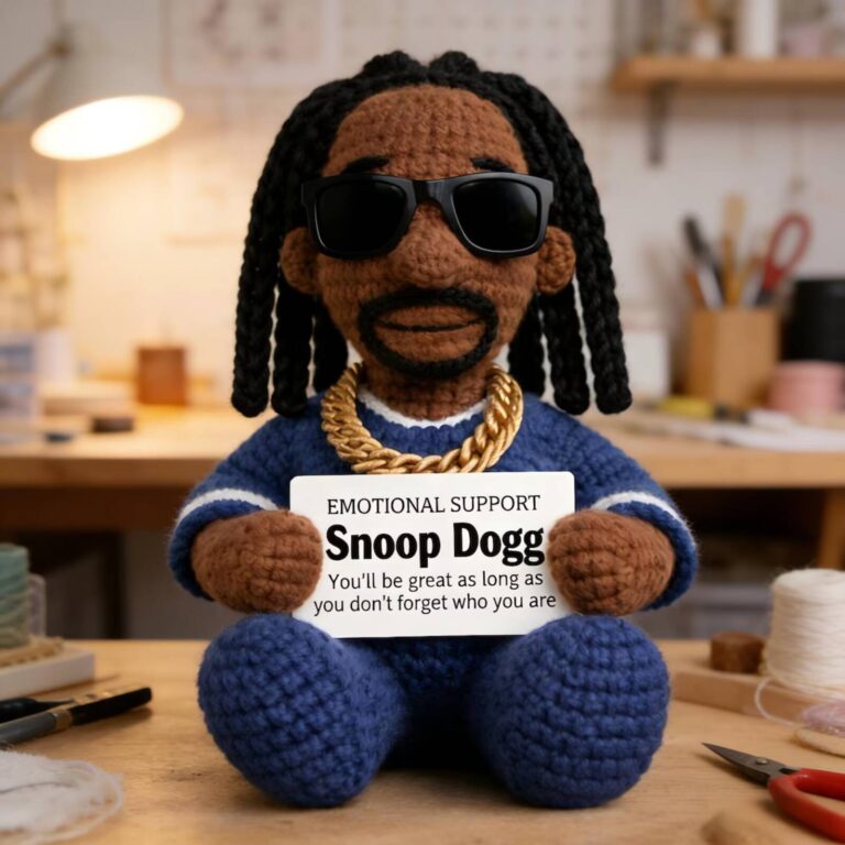 Emotional support Snoop Dogg crochet doll in a blue jersey with sunglasses, gold chain and braids
