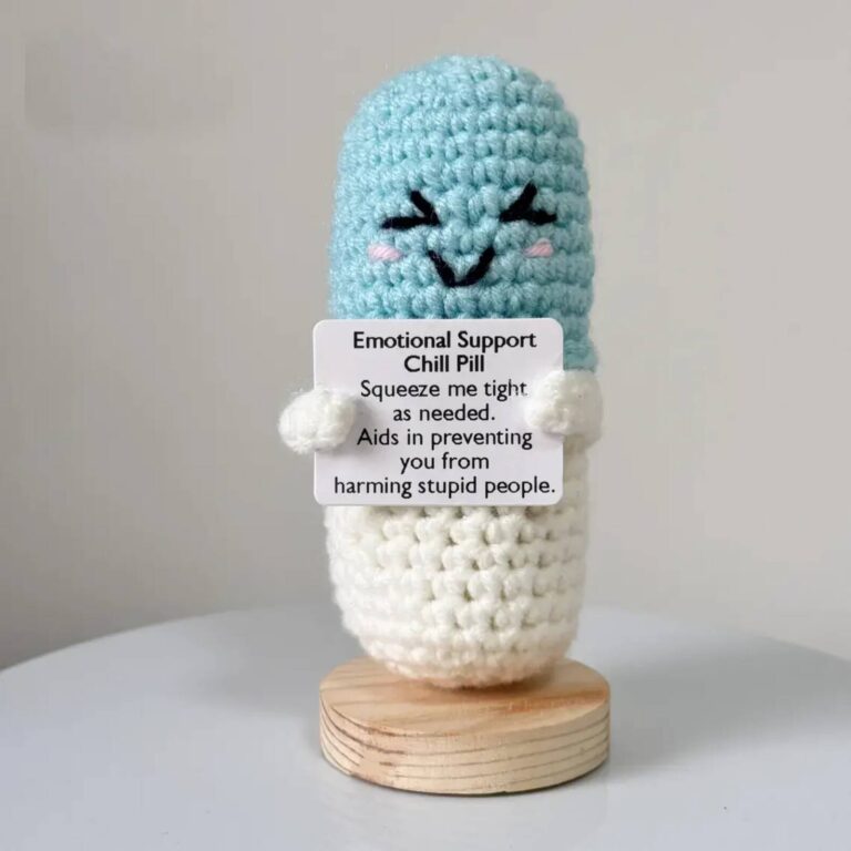 Emotional Support Chill Pill crochet plush, a blue and white capsule with a sleepy smiling face