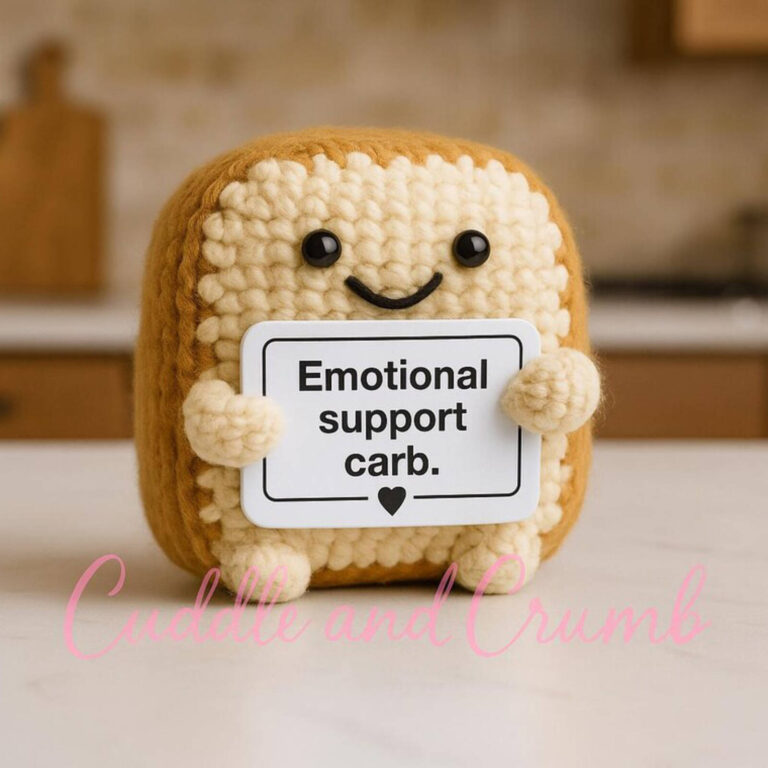 Emotional support carb crochet toast plush with a smiling face, holding a sign