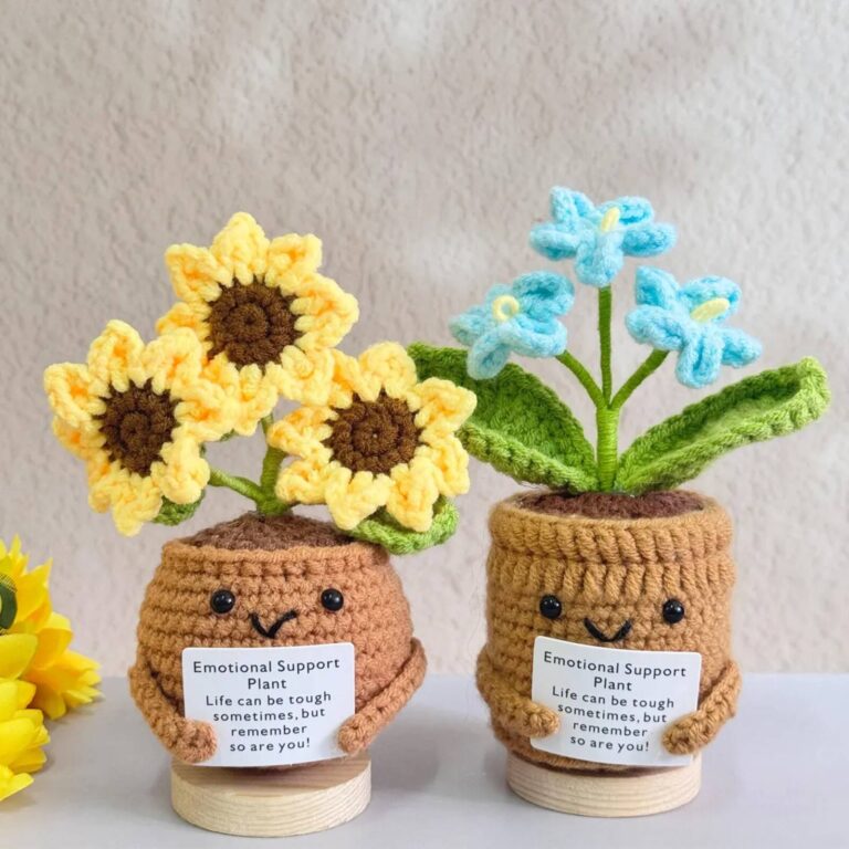 Two emotional support plant pot crochet dolls with crochet sunflowers and blue flowers