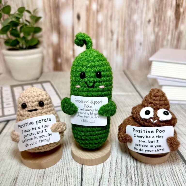 Emotional support pickle, positive potato and positive poo crochet figures on wooden stands