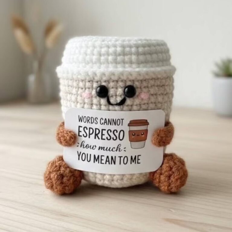Emotional support espresso cup crochet plush holding a card that reads Words Cannot Espresso