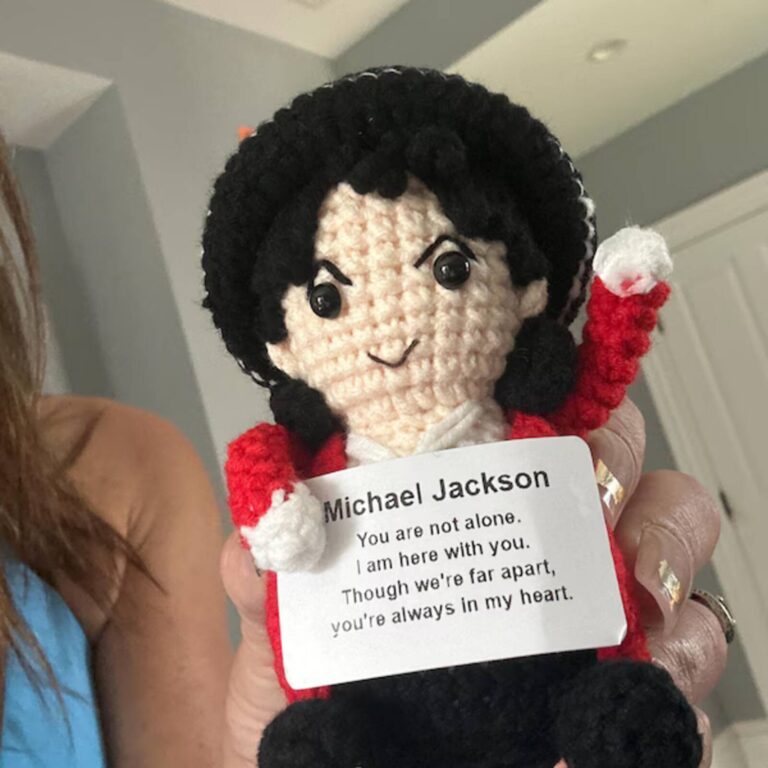 Emotional support Michael Jackson crochet doll in a red jacket with a raised white-gloved hand