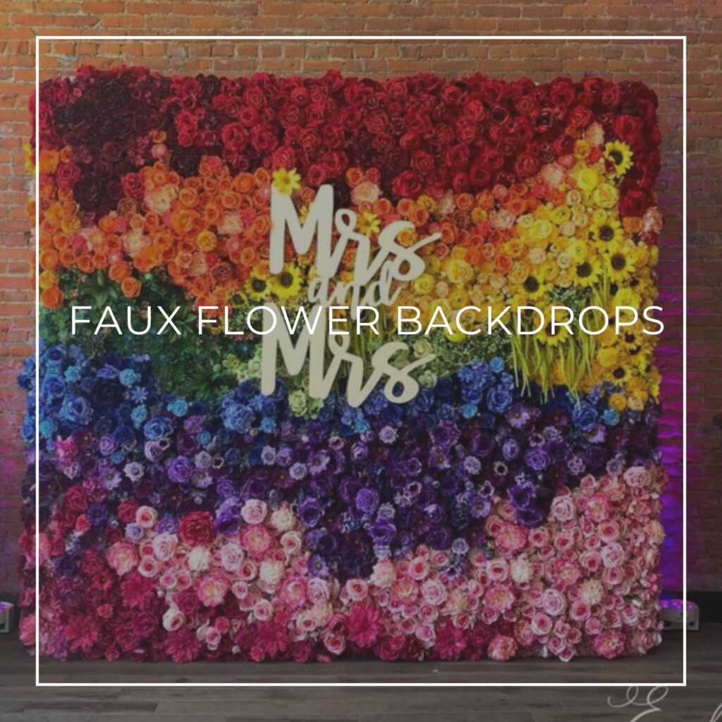 rainbow colored 'Mrs & Mrs' faux flower wedding party backdrop