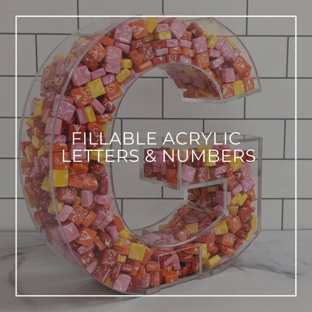 letter G acrylic display container filled with colorful candy