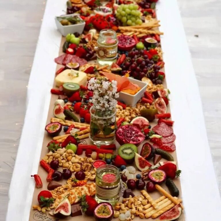 Grazing table spread with meats and cheeses