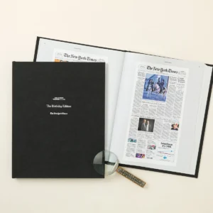 Open Historic Headlines Birthday Book showing two original New York Times front pages, unedited product photo