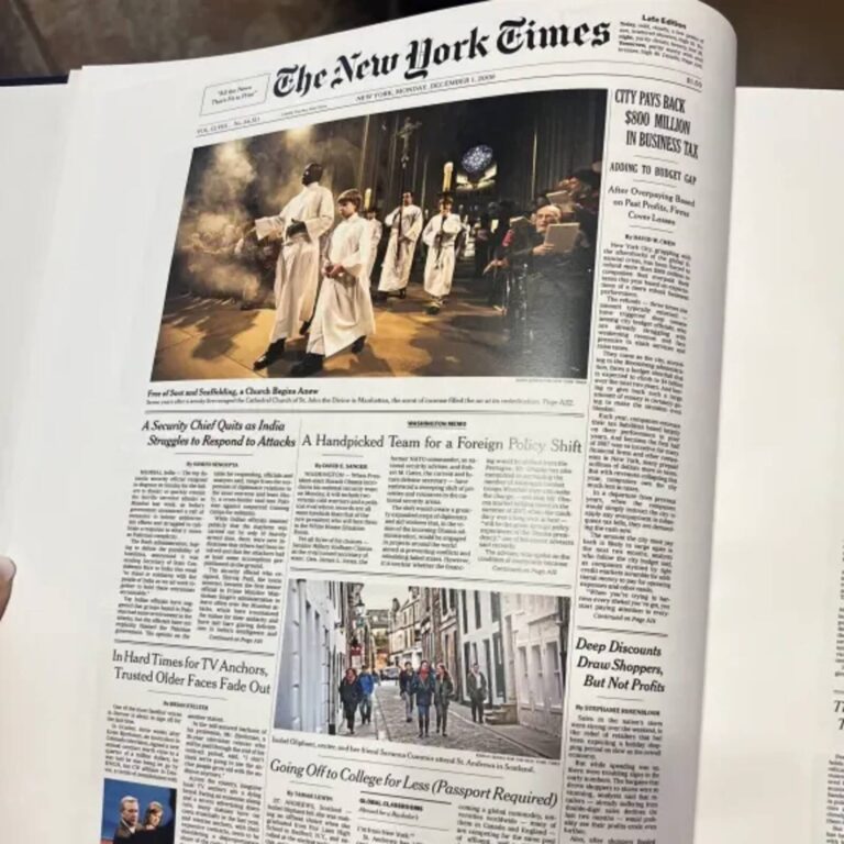 Open Historic Headlines Birthday Book showing a New York Times front page with a cathedral procession photo