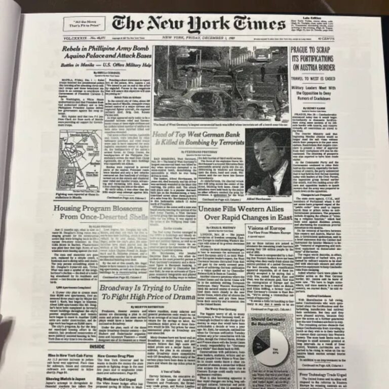 Open New York Times front page inside the Historic Headlines Birthday Book from a 1989 edition