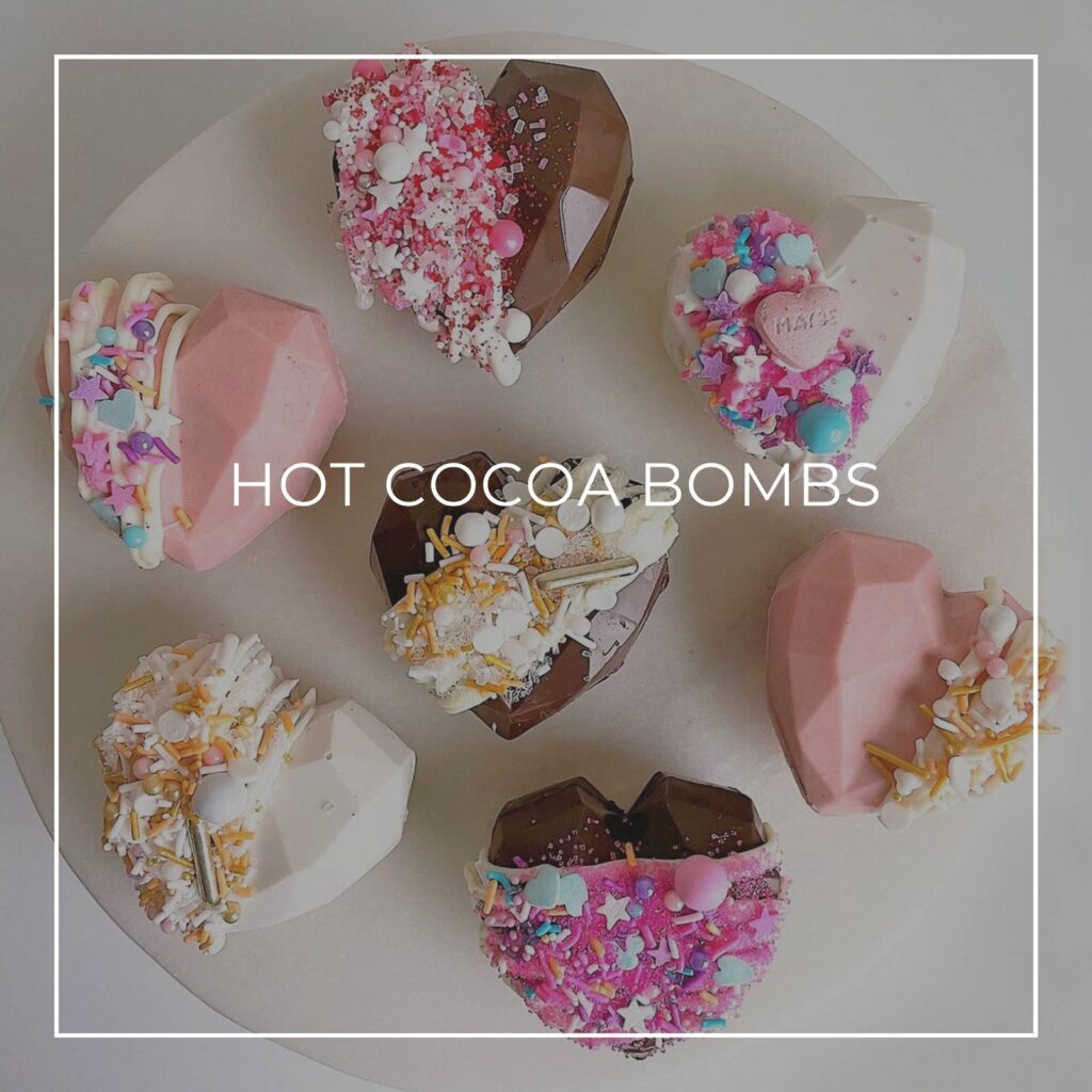 elaborately decorated heart shaped hot cocoa bombs