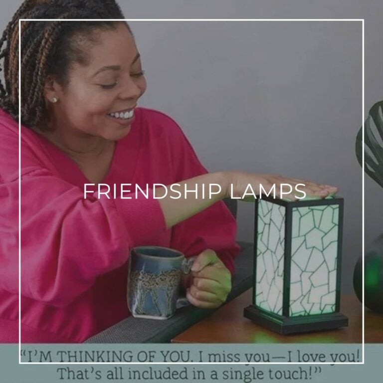 Woman touching a mosaic friendship lamp beside her coffee mug