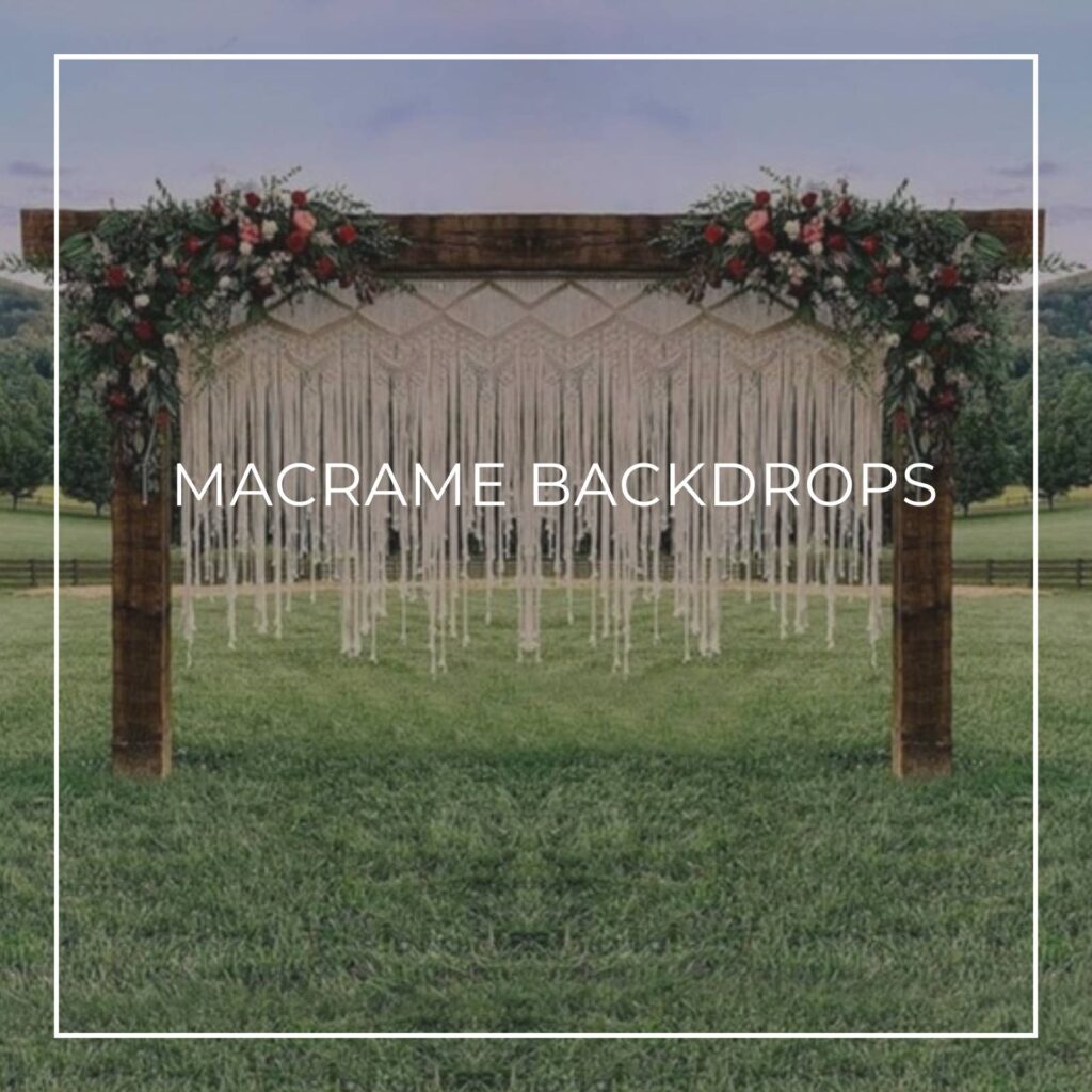 macrame backdrop hanging from a wooden frame dressed with flowers in a field