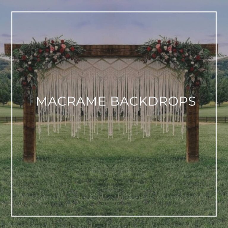 macrame backdrop hanging from a wooden frame dressed with flowers in a field