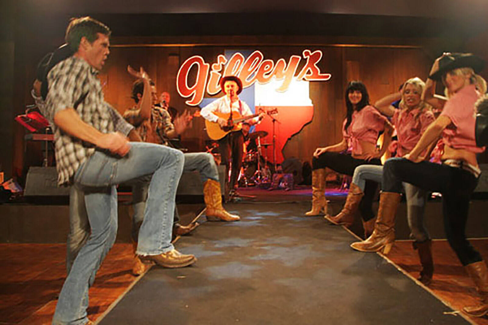 Country line dancers at 'Honky Tonk Blues' for The British Red Cross Ball produced by Matt James of Leftfield Productions