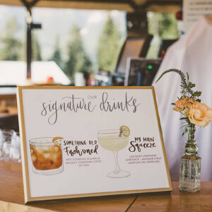 illustrated signature drinks sign on a party bar counter