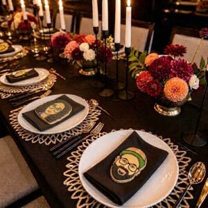custom portrait cookies on each place setting at a dinner table