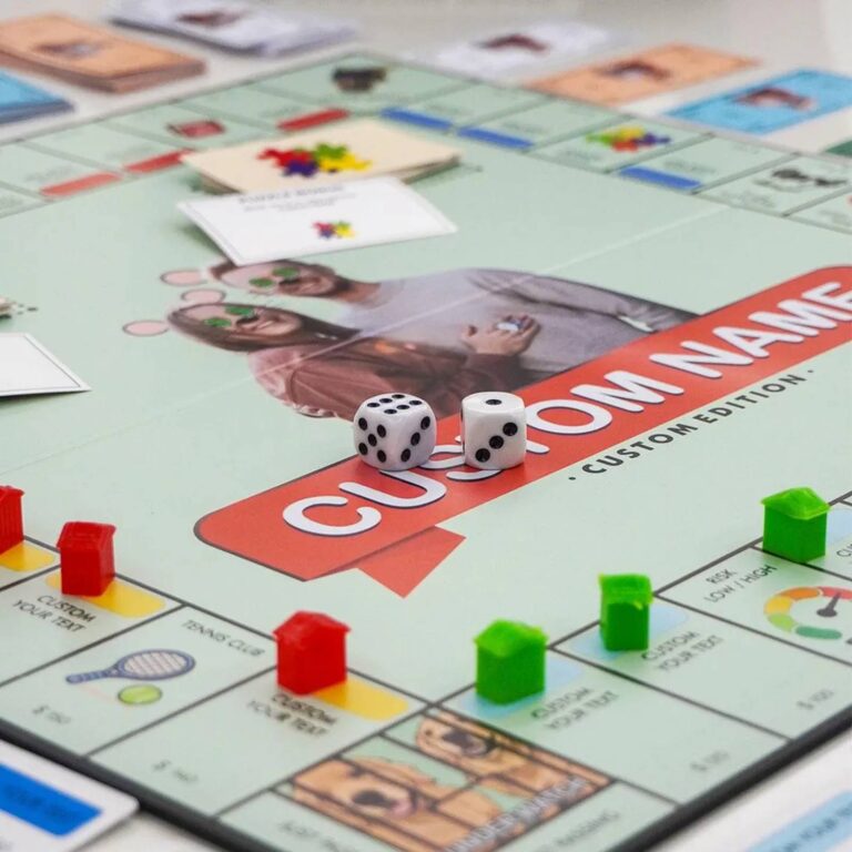 Close-up of dice and houses on Custom Name Monopoly board with couple’s photo detail
