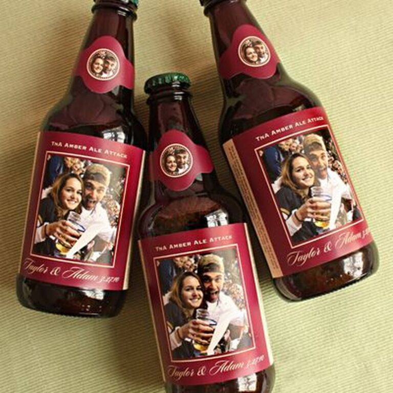 Three wedding beer bottles labeled "TnA Amber Ale Attack, Taylor & Adam," each printed with the same photo of the couple toasting