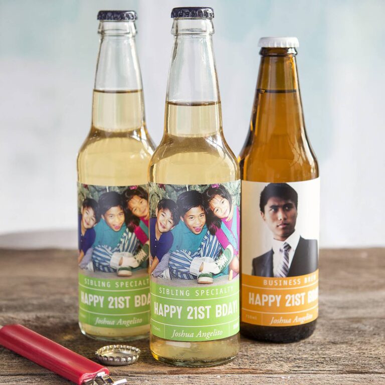 Three beer bottles labeled "Sibling Specialty" and "Business Brew, Happy 21st BDAY!" printed with a childhood sibling photo and a formal portrait