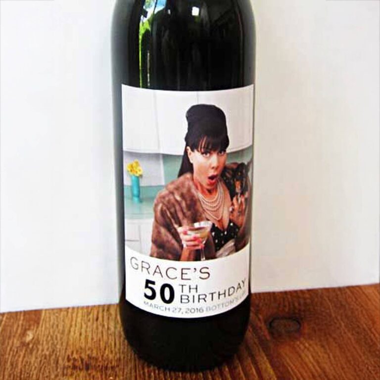 Wine bottle with a “Grace's 50th Birthday, March 27 2016, Bottom's Up” label featuring a surprised woman in a fur stole holding a martini
