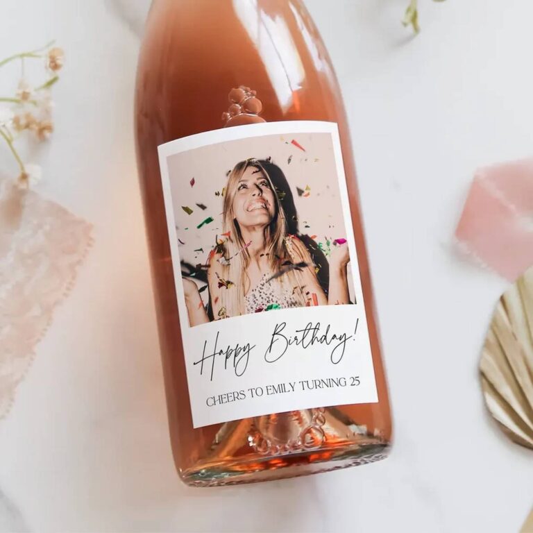 Wine bottle with a “Happy Birthday! Cheers to Emily Turning 25” label featuring a photo of a woman laughing under falling confetti
