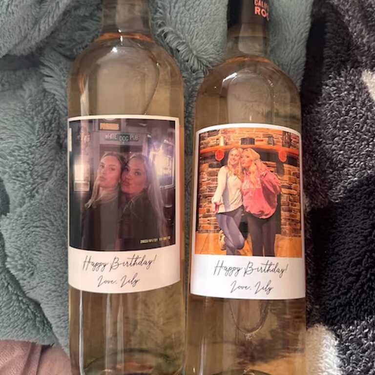 Two wine bottles with “Happy Birthday! Love, Lily” labels, each featuring a different selfie of two friends together