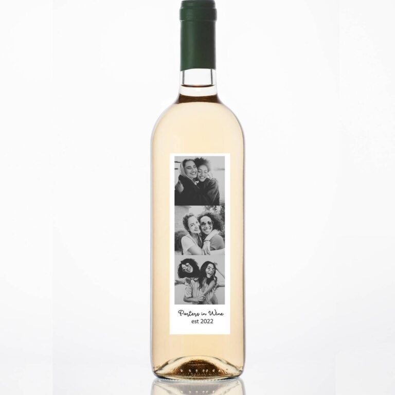 Wine bottle with a “Partners in Wine, est 2022” label featuring a black-and-white photo strip of two women hugging and laughing together