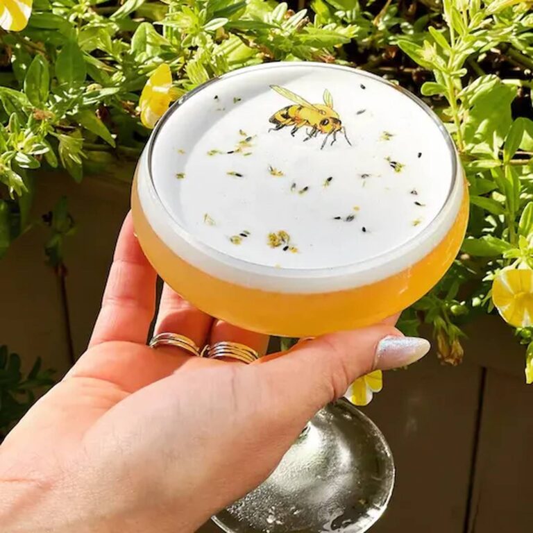 Edible bee topper on a foam-topped cocktail