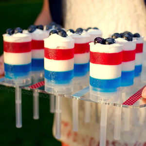 red, white, and blue desserts served in push-up pop containers