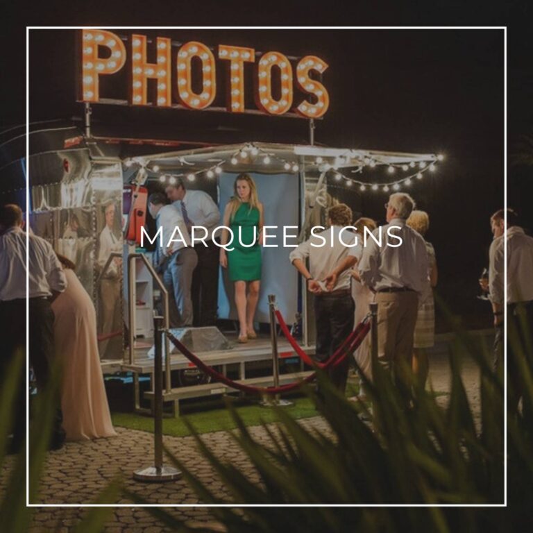marquee letter sign spelling PHOTOS above a retirement party photo booth