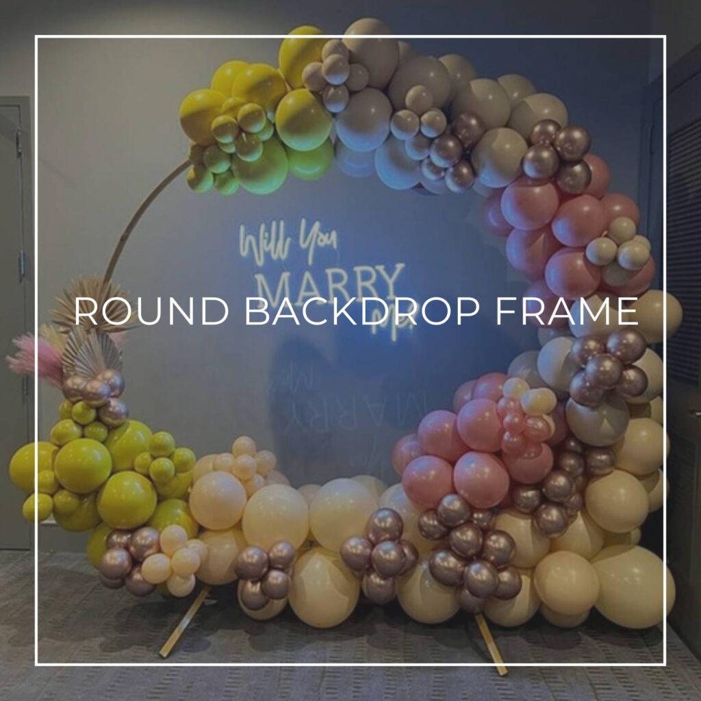 metal round backdrop frame decorated with pastel blue and gray balloons