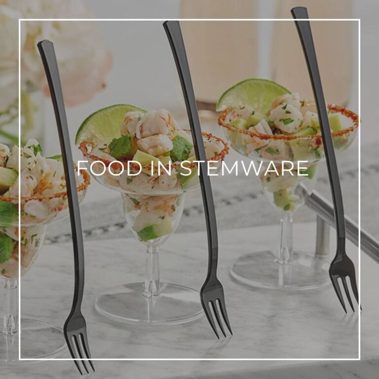 fish salad served in margarita glasses with forks