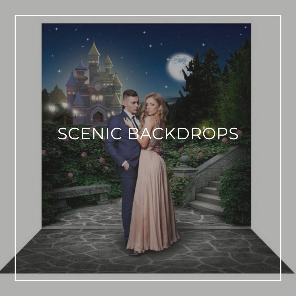 couple standing in front of a scenic party backdrop of a fairy tale castle at night