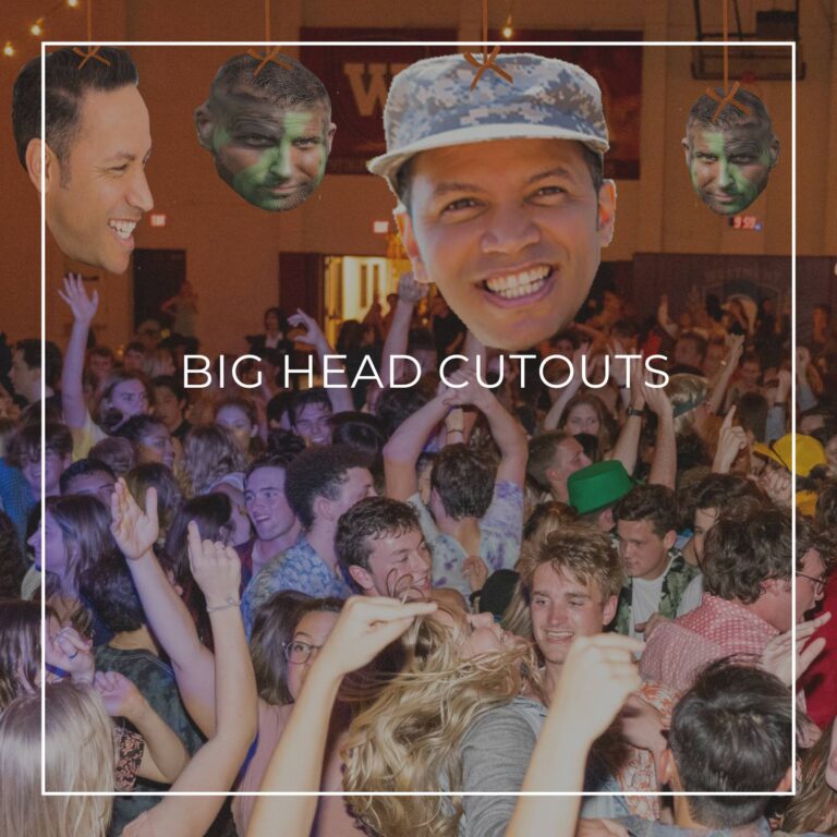 giant custom face cutouts of a man used as hanging decorations above a crowd of dancing party guests