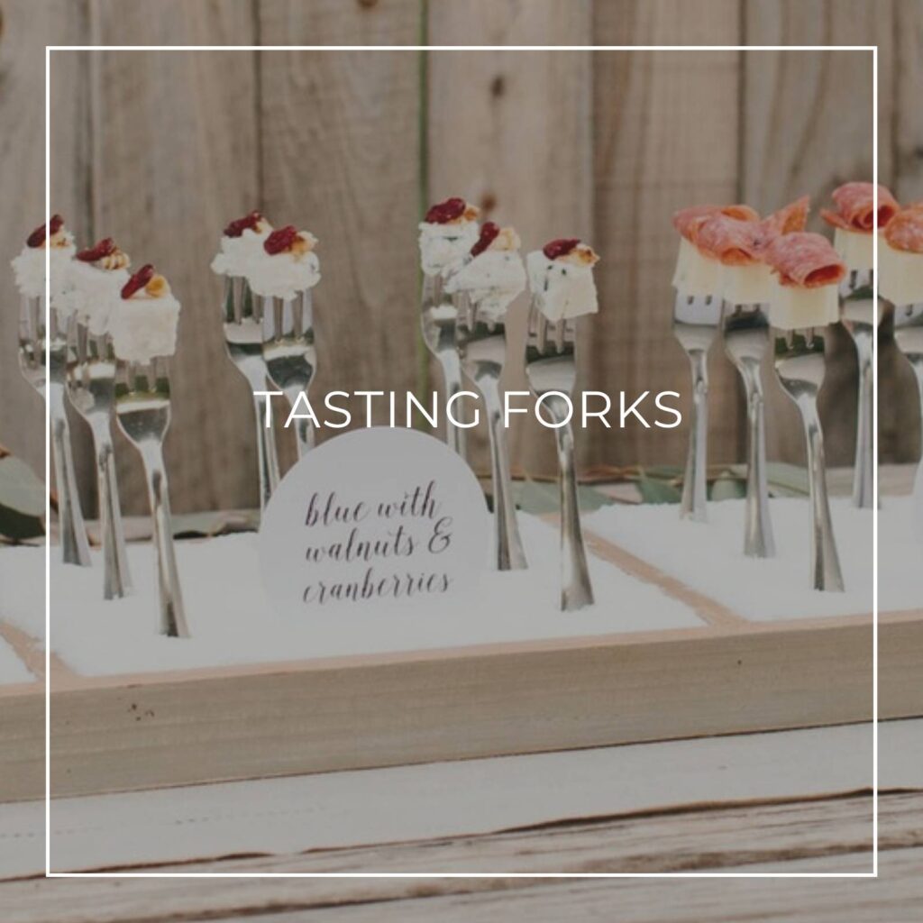 cheese bites served on tasting forks standing upright