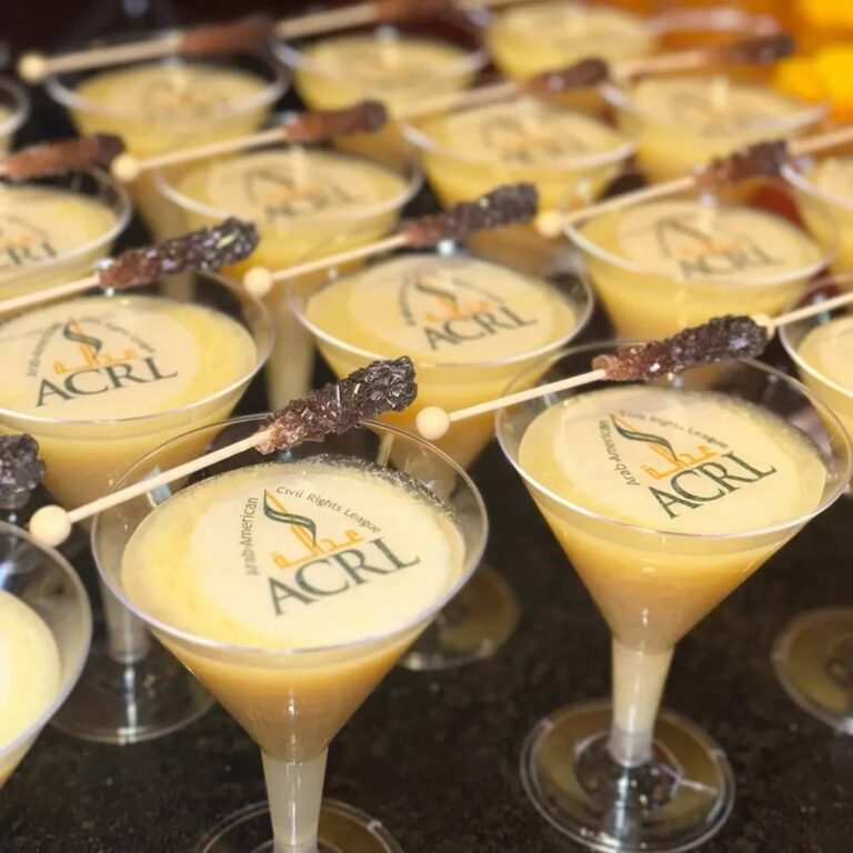 Edible logo topper reading "ACRL" on martini glasses