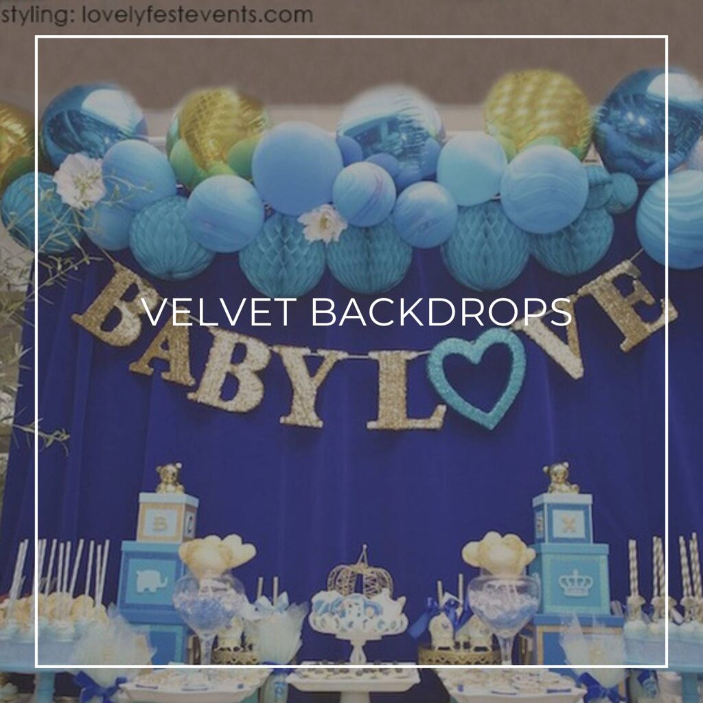 royal blue velvet baby shower dessert table party backdrop with blue and gold balloons