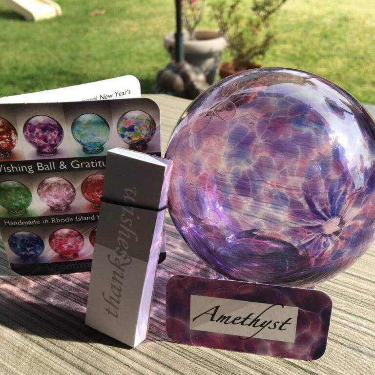 Purple Amethyst glass wishing ball with its catalog card and name tag