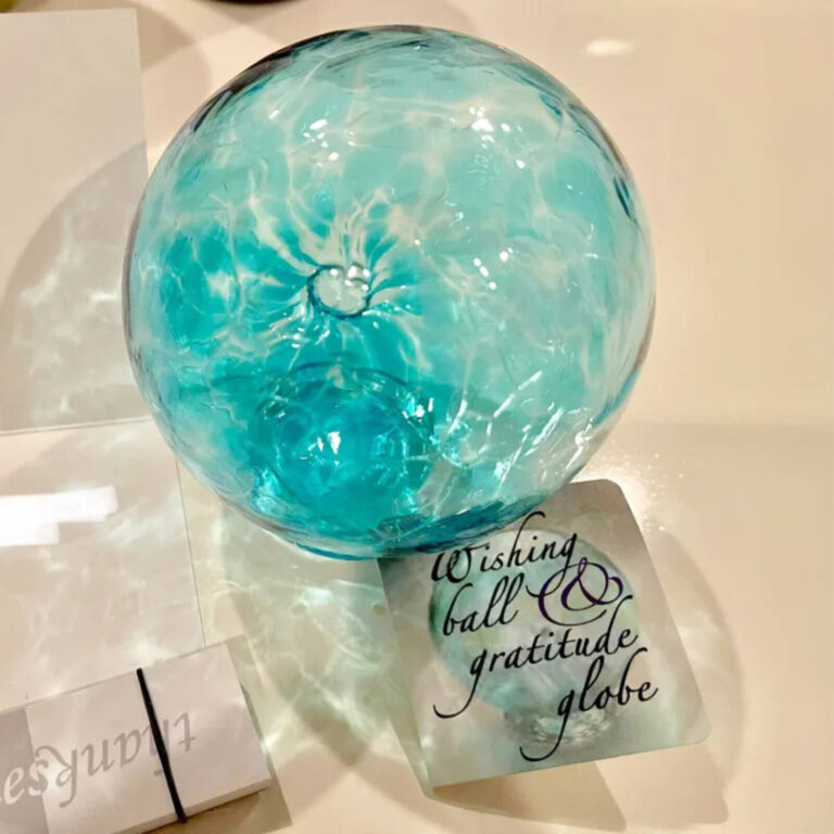 Aqua glass Wishing Ball and Gratitude Globe with its product tag