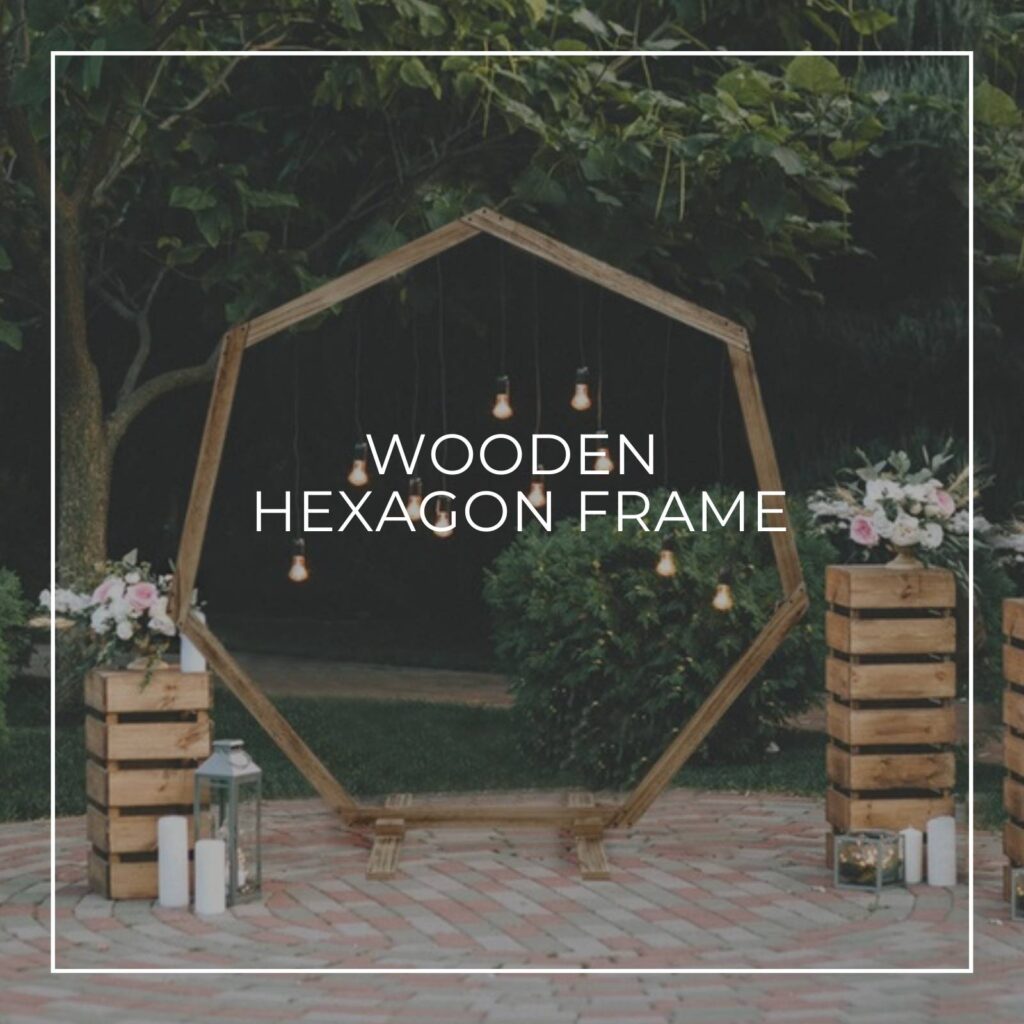 wooden hexagon party backdrop frame outside with lights hanging from it
